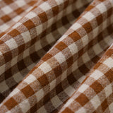 Rudas Plaid Be Rankovių Midi Suknelė" can be rewritten as "Brown Plaid Sleeveless Midi Dress.